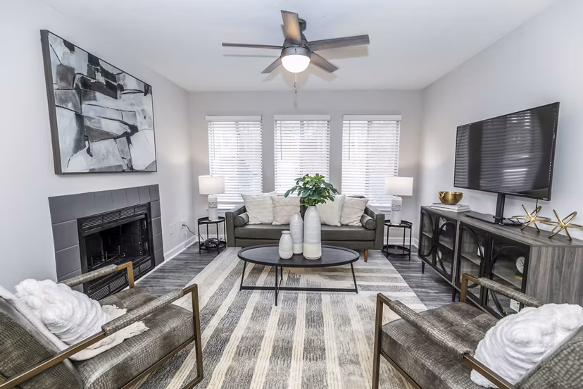 Spacious living room with modern decor at Champions Glen Apartments in Atlanta