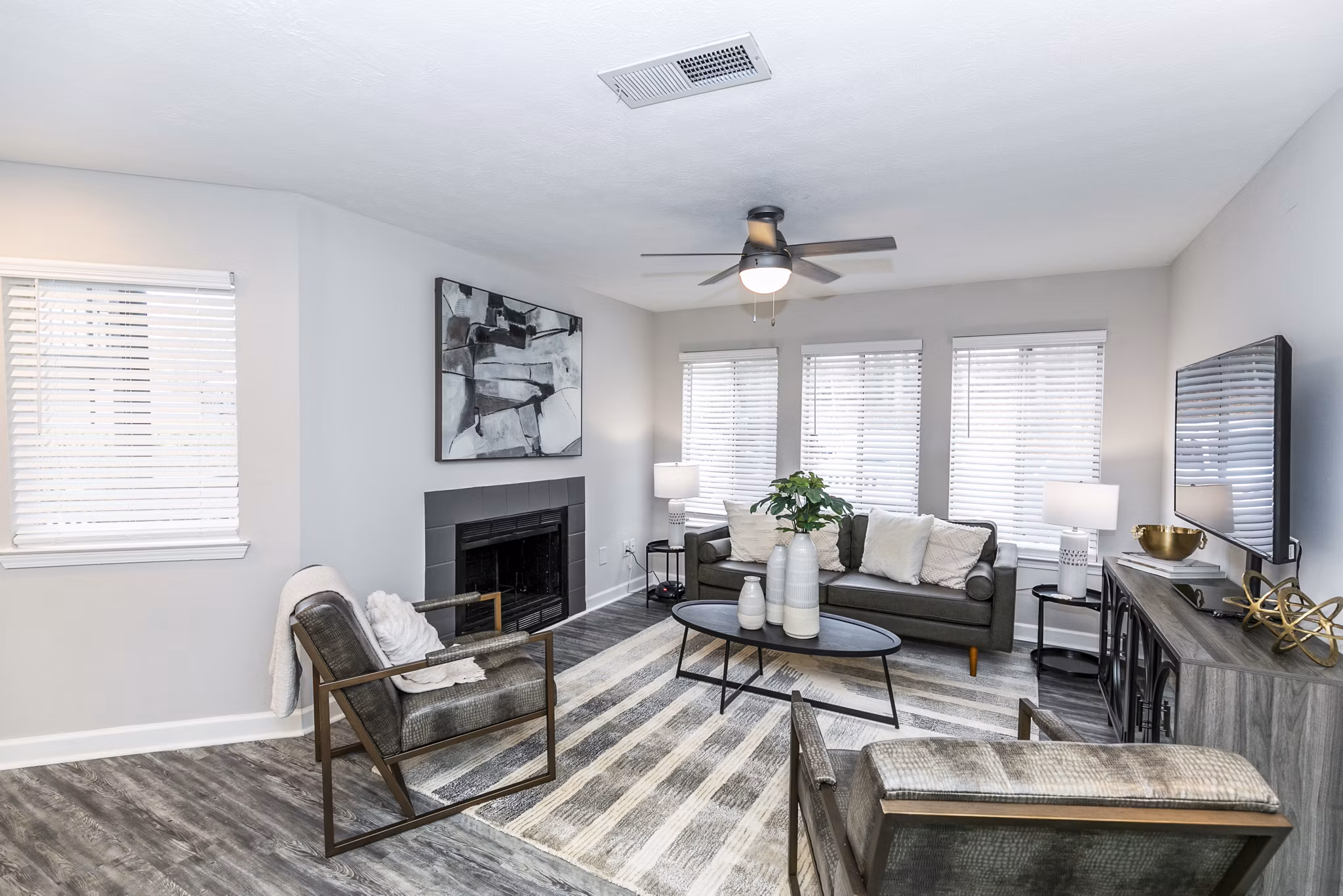 Spacious living room with modern furnishings at Champions Glen Apartments