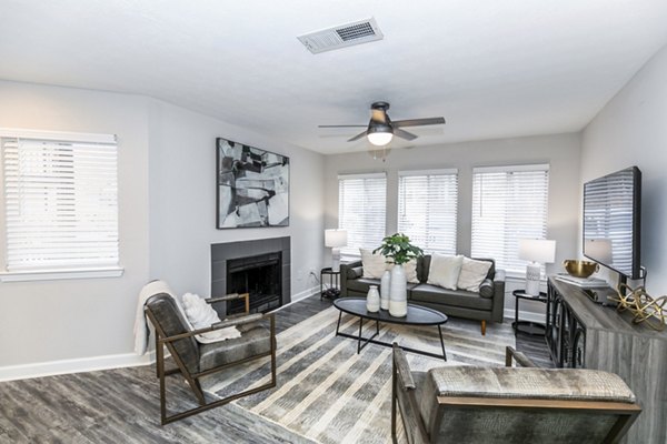 Spacious living room with modern furnishings at Champions Glen Apartments