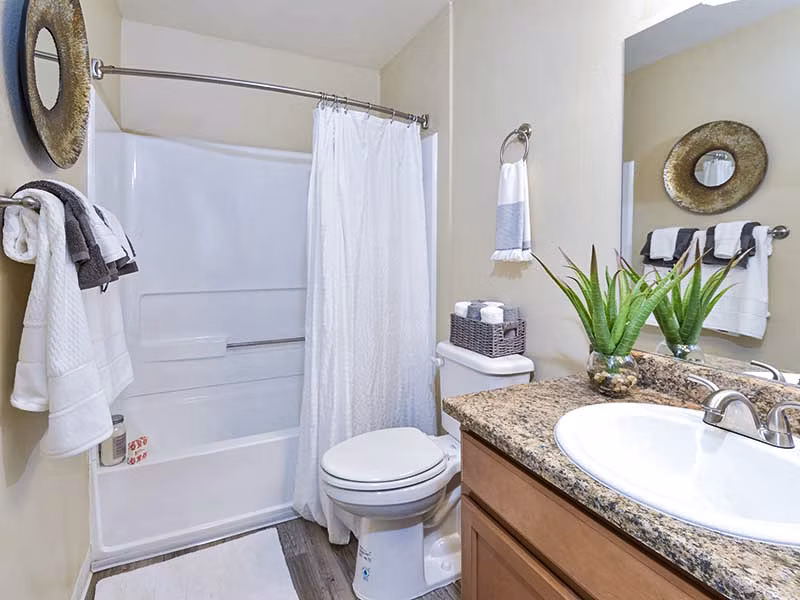 Bathroom featuring modern fixtures and elegant tilework at Vineyard Gardens Apartments