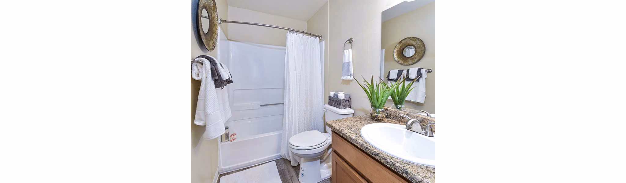 Bathroom featuring modern fixtures and elegant tilework at Vineyard Gardens Apartments