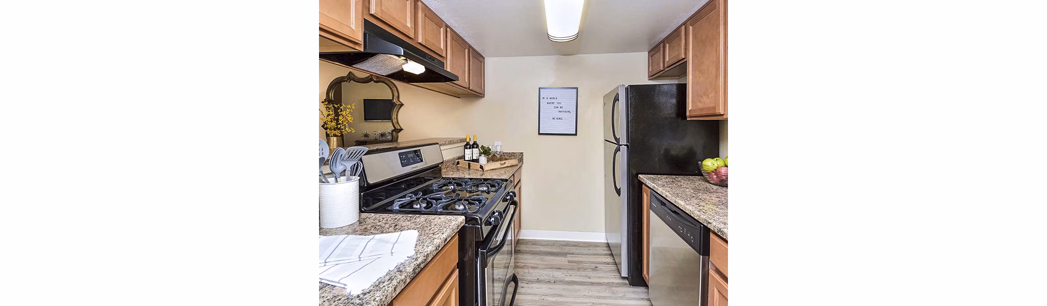 Modern kitchen with stainless steel appliances at Vineyard Gardens Apartments