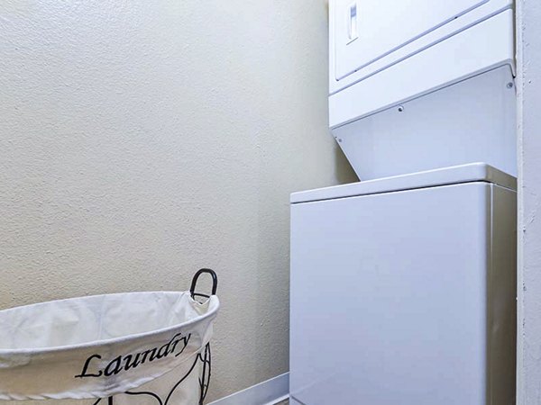 Laundry room with modern appliances at Vineyard Gardens Apartments