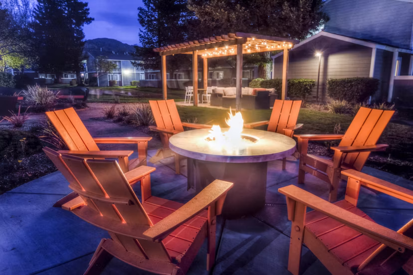 Cozy fire pit on a spacious patio at Vineyard Gardens Apartments, ideal for relaxing evenings and social gatherings