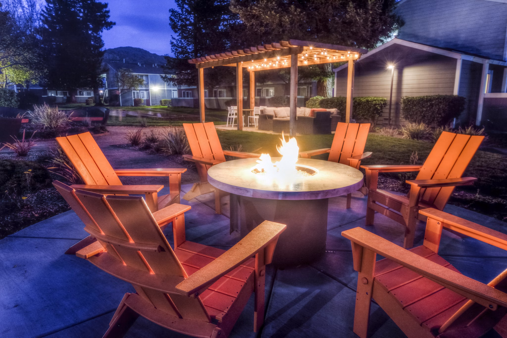 Cozy fire pit on a spacious patio at Vineyard Gardens Apartments, ideal for relaxing evenings and social gatherings