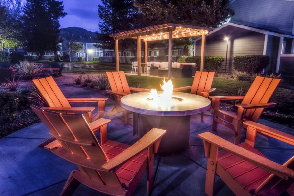Cozy fire pit on a spacious patio at Vineyard Gardens Apartments, ideal for relaxing evenings and social gatherings