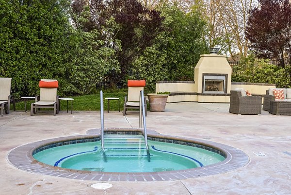 Hot tub amenity at Vineyard Gardens Apartments with relaxing design and lush surroundings