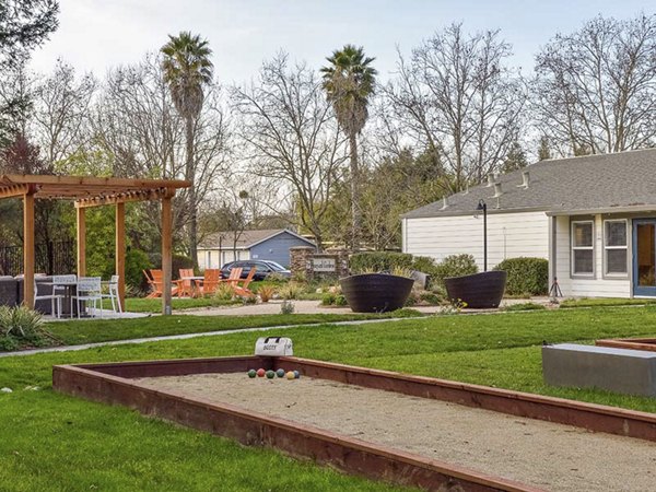 Recreational area with lush greenery at Vineyard Gardens Apartments luxury community