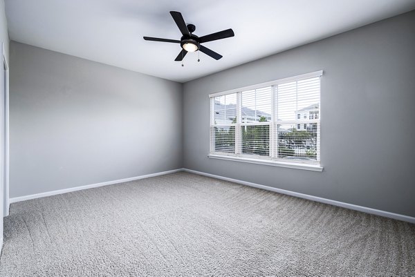 Spacious bedroom with modern decor at River Oaks Landing Apartments