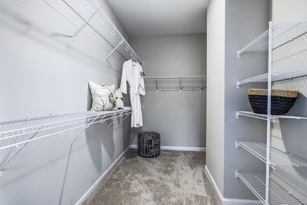 Spacious bedroom closet with built-in shelving at River Oaks Landing Apartments