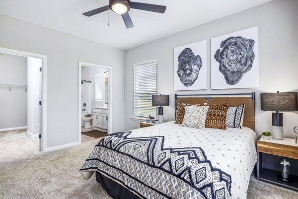 Luxurious bedroom with elegant decor at River Oaks Landing Apartments, offering a serene living environment