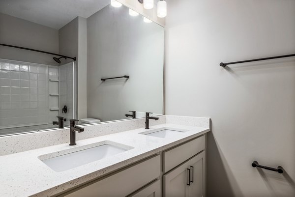 Modern bathroom with sleek fixtures at River Oaks Landing Apartments, offering luxury living and style