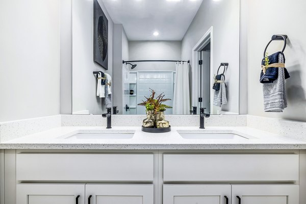 Modern bathroom with sleek fixtures at River Oaks Landing Apartments