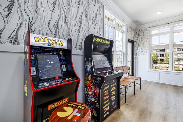 Clubhouse game room with billiards and lounge seating at River Oaks Landing Apartments Perfect for relaxation and recreation