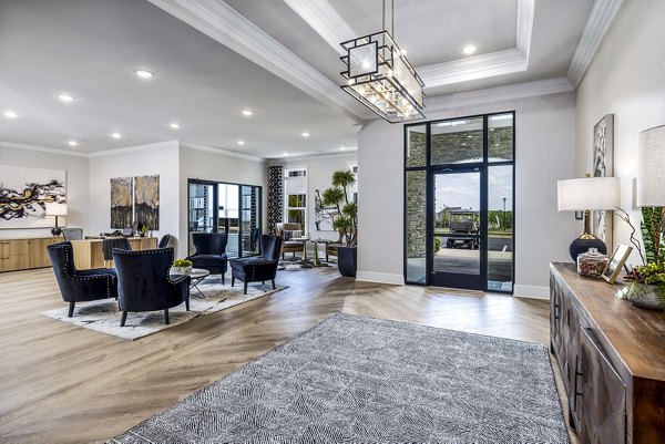Clubhouse featuring modern design and comfortable seating at River Oaks Landing Apartments