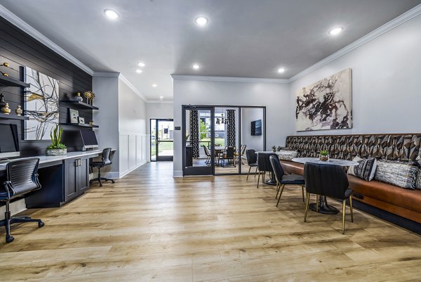 Business center with modern workstations at River Oaks Landing Apartments for a premium workspace experience