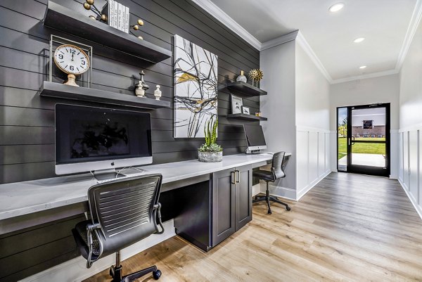 Business center with modern workstations at River Oaks Landing Apartments