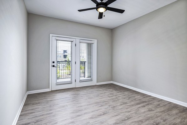Spacious living room with modern decor in River Oaks Landing Apartments