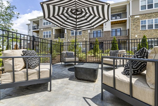Cozy patio space with modern furnishings at River Oaks Landing Apartments, perfect for outdoor relaxation