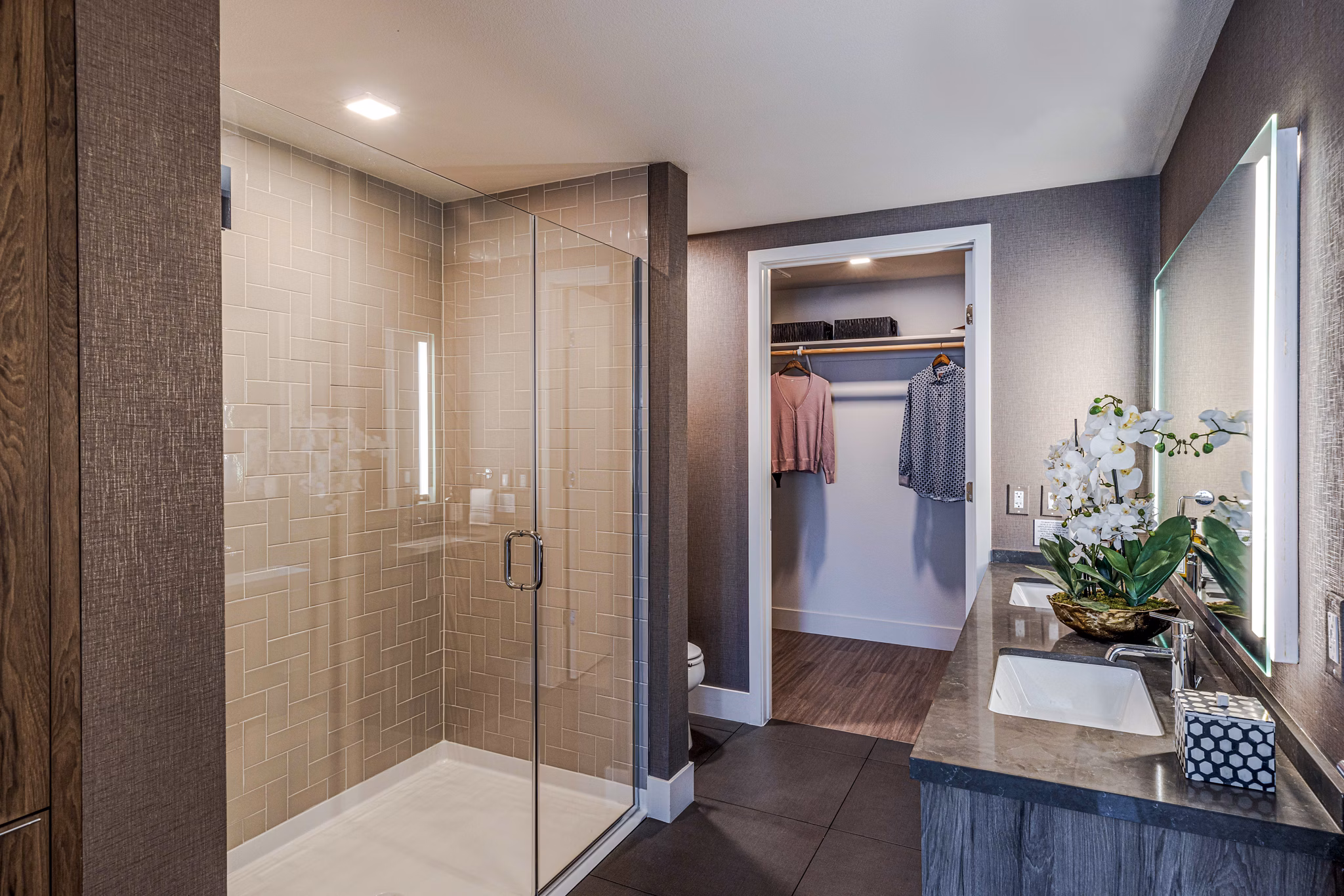 Bathroom showcasing modern fixtures and marble countertops at Landsby Apartments