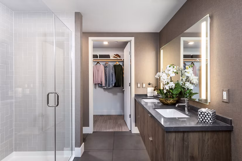 Bathroom with modern fixtures and elegant tile in Landsby Apartments