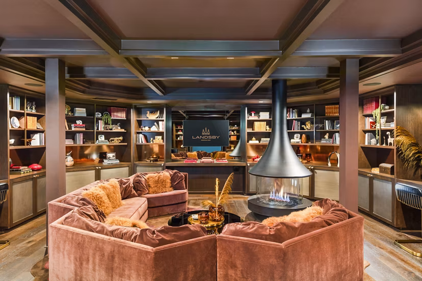 Modern clubhouse interior featuring sleek design and spacious seating at Landsby Apartments