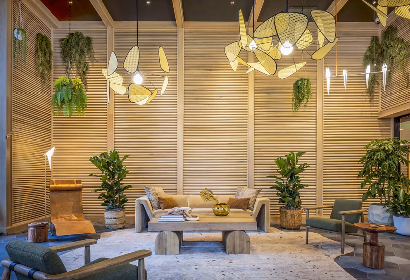 Modern clubhouse featuring plush seating and large-screen TV at Landsby Apartments, offering luxury social spaces in Mountain View, CA.