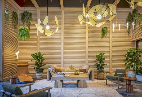 Modern clubhouse featuring plush seating and large-screen TV at Landsby Apartments, offering luxury social spaces in Mountain View, CA.