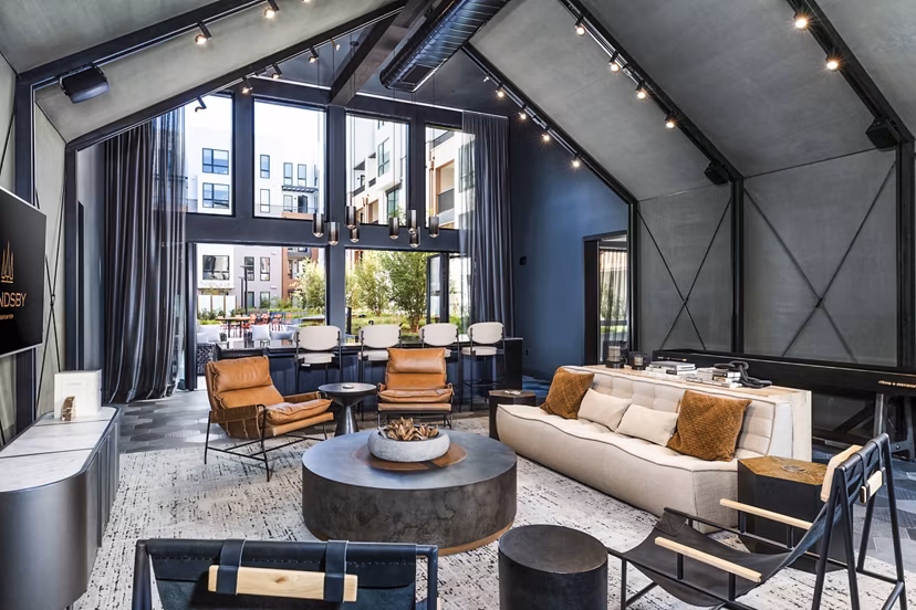 Clubhouse with modern design and comfortable seating at Landsby Apartments, a luxury property by Greystar