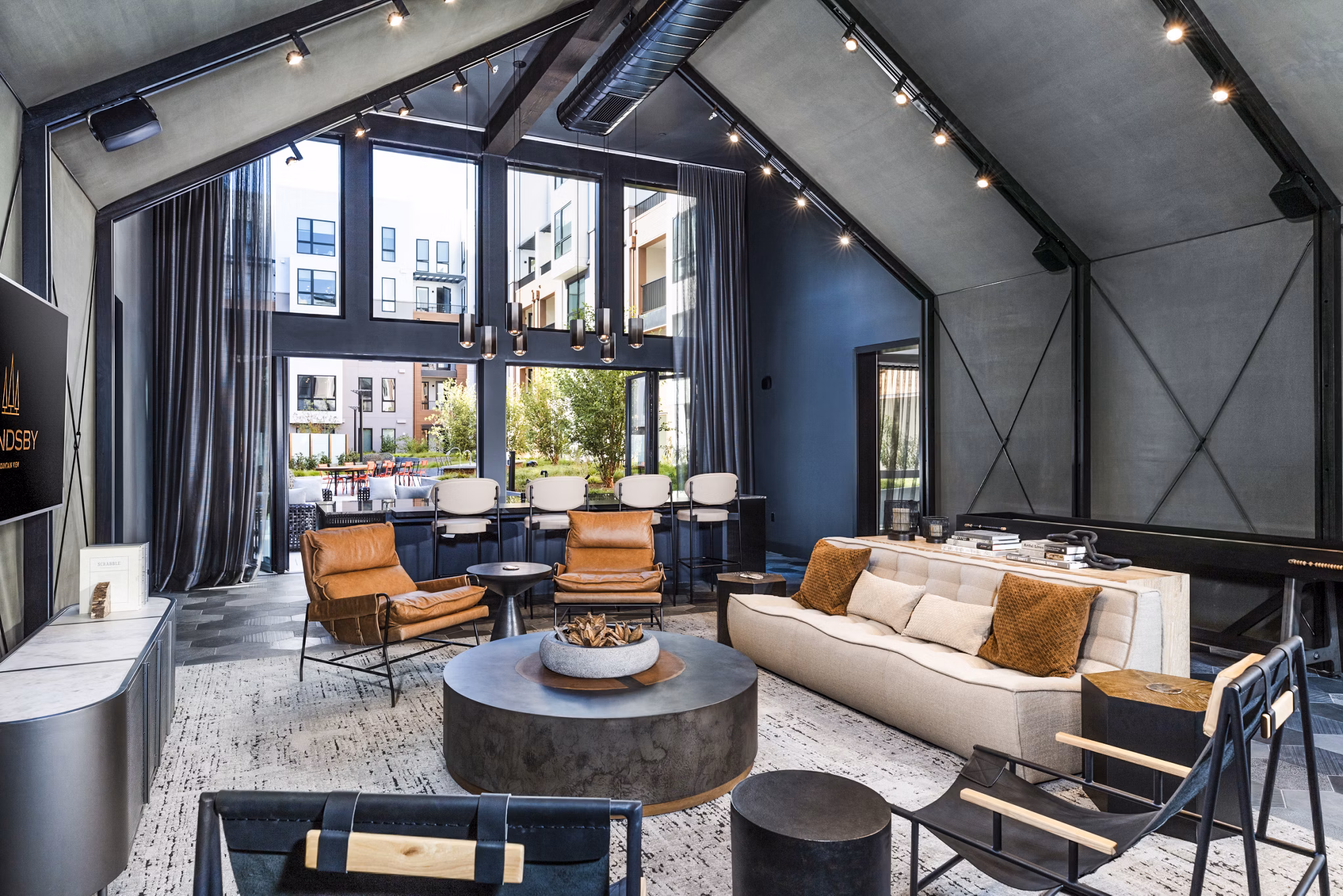 Clubhouse with modern design and comfortable seating at Landsby Apartments, a luxury property by Greystar