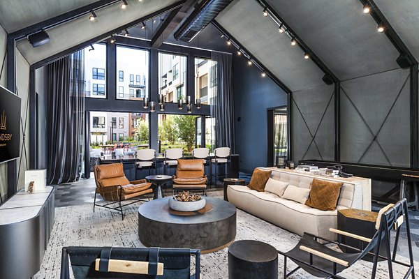 Clubhouse with modern design and comfortable seating at Landsby Apartments, a luxury property by Greystar