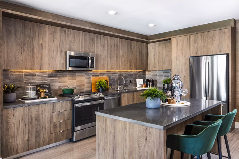 Contemporary kitchen with stainless steel appliances at Landsby Apartments, a luxury residence