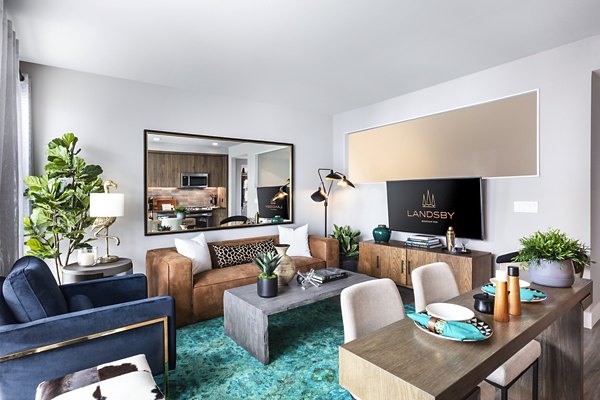 Spacious living room with modern decor at Landsby Apartments featuring luxury design elements