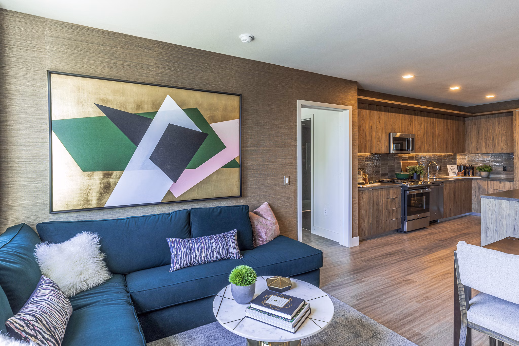 Modern living room with Scandinavian design at Landsby Apartments, featuring sleek furniture and natural light