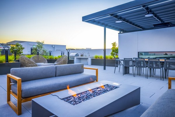Cozy fire pit on patio at Landsby Apartments, a luxury Greystar community