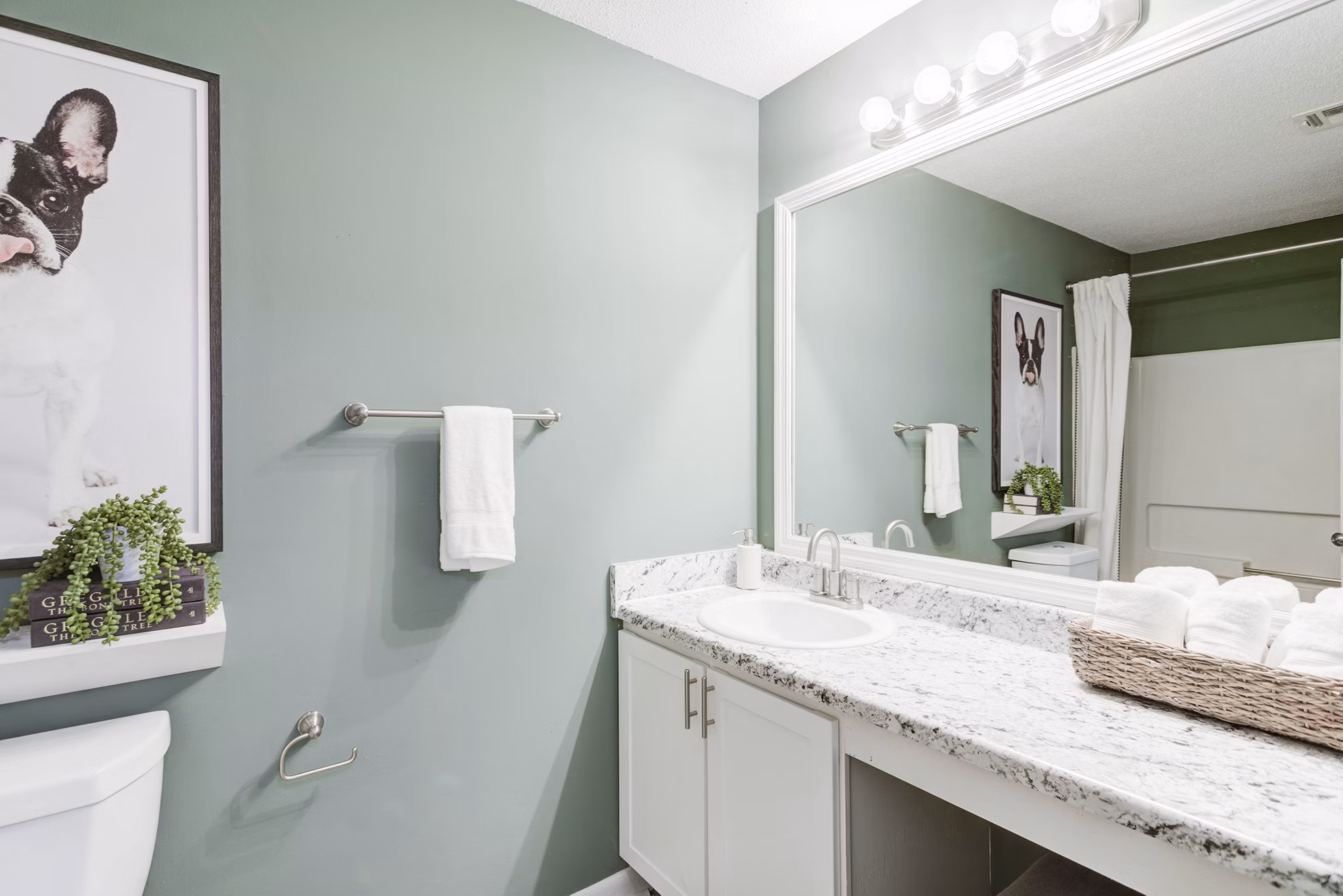 Elegant bathroom with modern fixtures at Avana Collins Creek Apartments, offering luxury living from Greystar