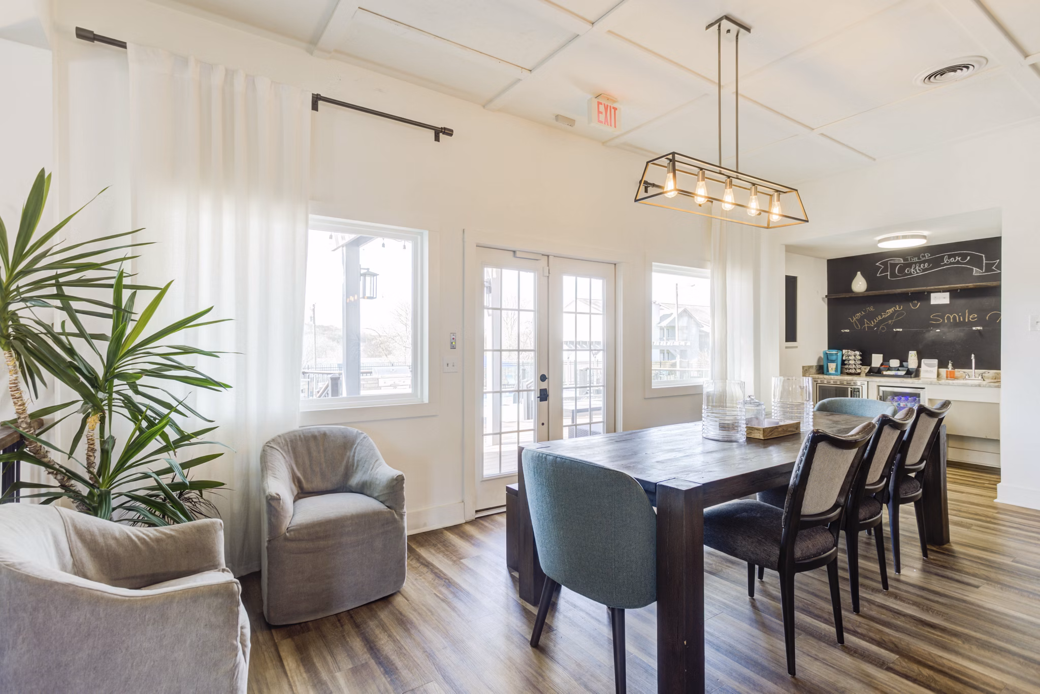 Clubhouse featuring modern seating and entertainment options at Avana Collins Creek Apartments