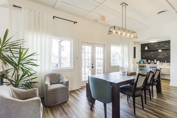 Clubhouse featuring modern seating and entertainment options at Avana Collins Creek Apartments