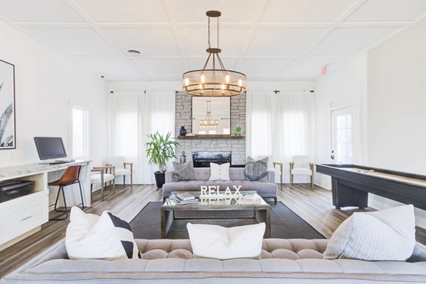 Clubhouse featuring modern design and comfortable seating at Avana Collins Creek Apartments