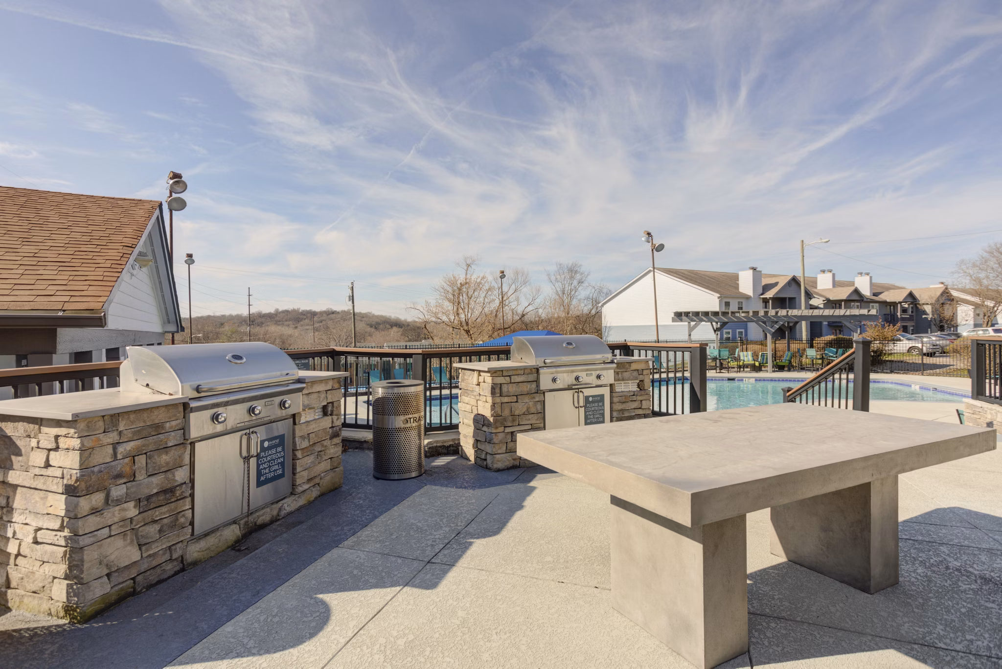 Outdoor grilling area with modern grills at Avana Collins Creek luxury apartments suitable for small gatherings