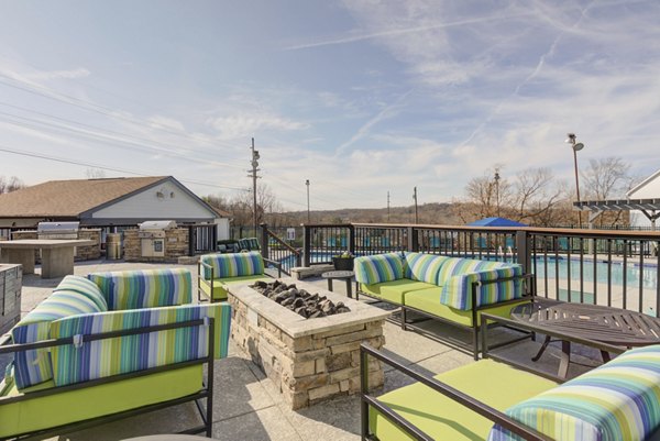 Cozy fire pit area at Avana Collins Creek Apartments offering a perfect outdoor gathering spot