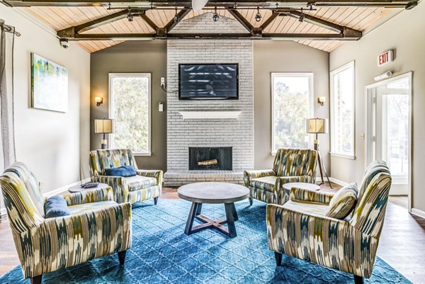 Clubhouse/lobby with modern seating and lighting at Avana South Oaks Apartments