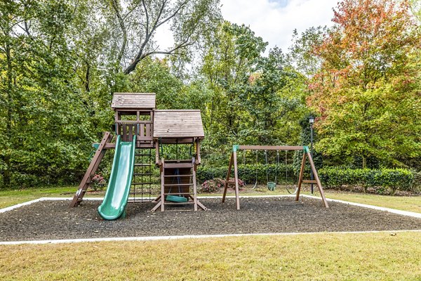 Colorful playground set at Avana South Oaks Apartments, featuring slides and swings for resident enjoyment