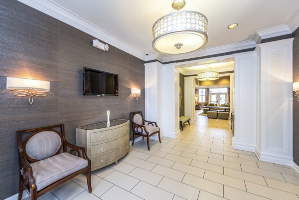 Elegant clubhouse lobby with contemporary decor at Pinnacle at Town Center Apartments, showcasing luxurious amenities and sophisticated design