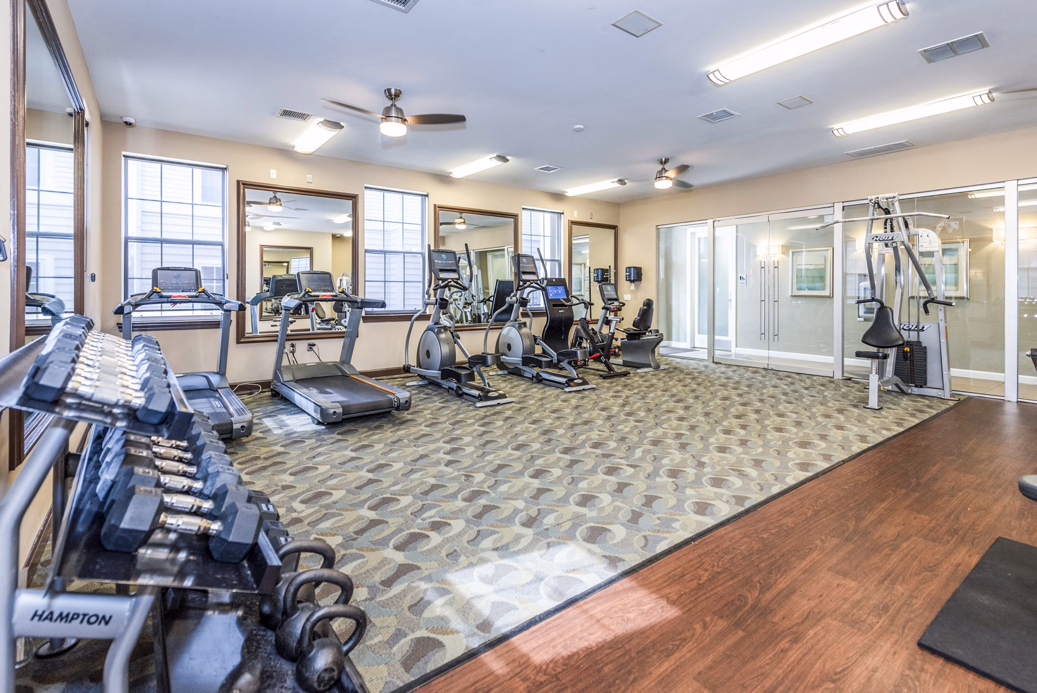 State-of-the-art fitness center at Pinnacle at Town Center Apartments featuring modern workout equipment