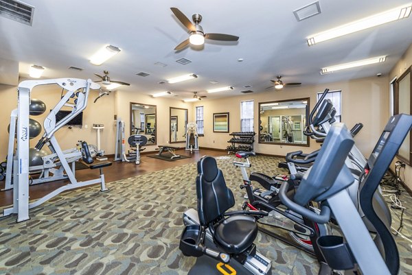 Fitness center with modern equipment at Pinnacle at Town Center Apartments
