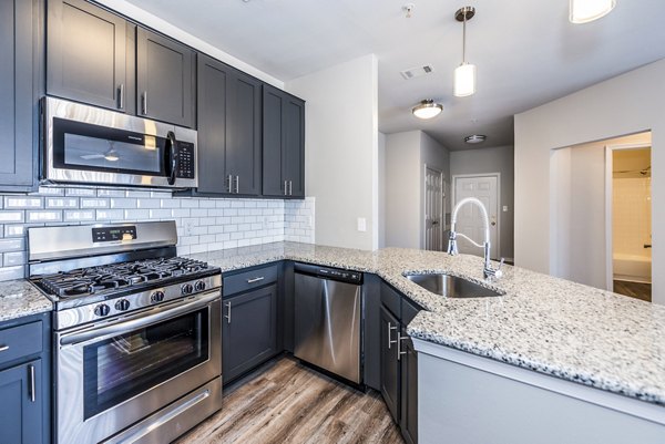 Spacious kitchen with modern appliances in Pinnacle at Town Center Apartments