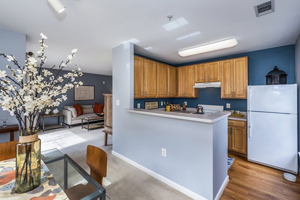 Modern kitchen with stainless steel appliances at Pinnacle at Town Center Apartments