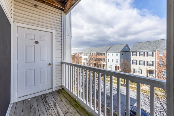 Modern patio with stylish seating and greenery at Pinnacle at Town Center Apartments