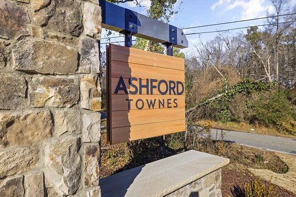 Ashford Townes Apartments: Elegant signage marking luxury living amidst serene surroundings